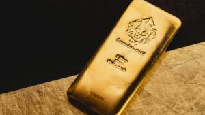 Scottsdale Mint 1-kilo gold bar stamped 9999 fine gold, above the IRS 99.5% fineness minimum for IRA-eligible gold