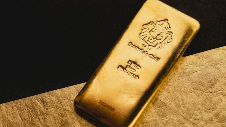 Scottsdale Mint 1-kilo gold bar stamped 9999 fine gold, above the IRS 99.5% fineness minimum for IRA-eligible gold